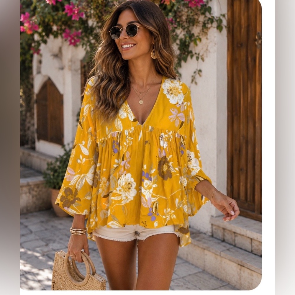 Free People yellow and white floral print Bella tunic blouse.